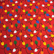 Colorful string lights pattern on a red background