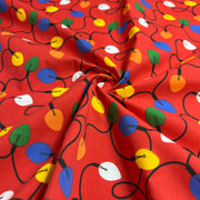 Red fabric with colorful Christmas light pattern