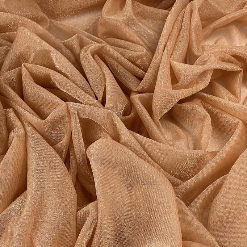 A close-up of draped champagne beige sheer fabric with a subtle shimmering texture, arranged in soft folds that fill the entire frame.