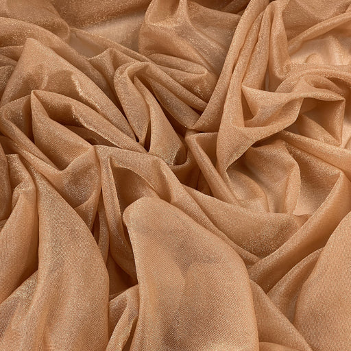 A close-up of draped champagne beige sheer fabric with a subtle shimmering texture, arranged in soft folds that fill the entire frame.
