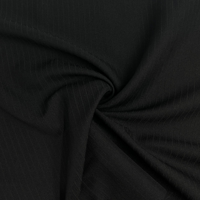 Close-up of black fabric with a subtle texture