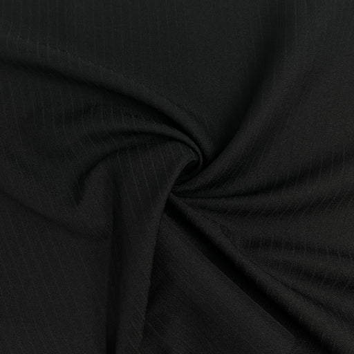 Close-up of black fabric with a subtle texture