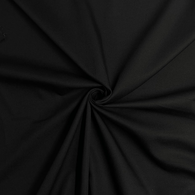 Black polyester and cotton based twill fabric with a 2x1 weave, crisp texture and versatile application