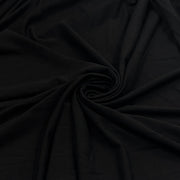 Black soft rayon and lycra jersey pulled into a swirl showing off smooth drape and texture. 