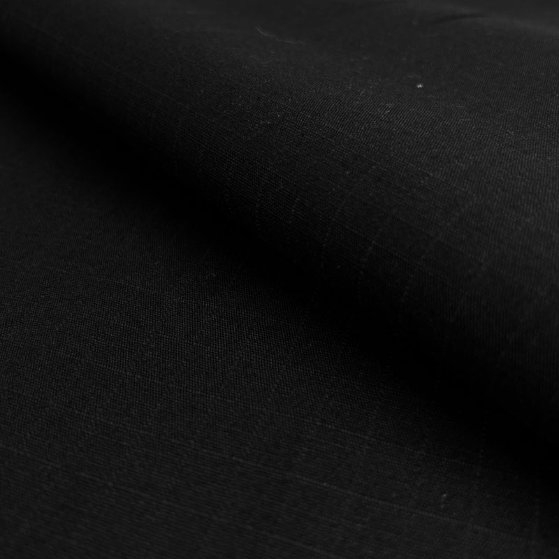 Closeup of black cotton canvas with 1/2 inch ripstop enforcement grid.