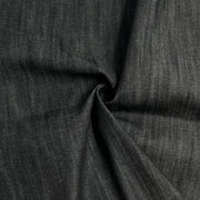 Black selvedge denim with mild stretch rolled into a swirl
