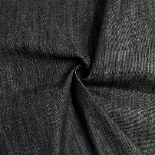 Black selvedge denim with mild stretch rolled into a swirl