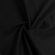 A close-up of draped black fabric with soft folds and a subtle sheen, filling the entire frame.