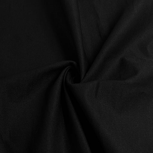 A close-up of draped black fabric with soft folds and a subtle sheen, filling the entire frame.
