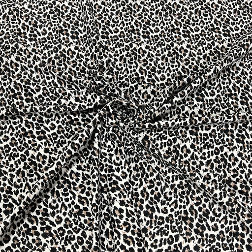 Black and white leopard print fabric with a gathered center, showing the texture and pattern details.