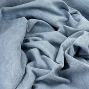 Bundle of denim featuring a blue wash coloring. 