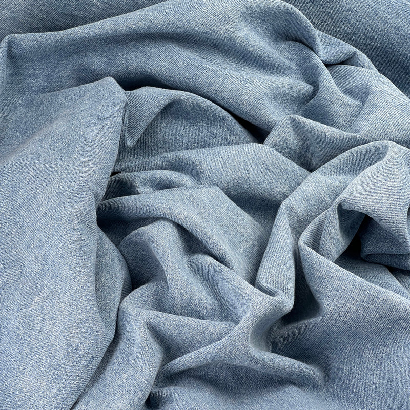 Bundle of denim featuring a blue wash coloring. 