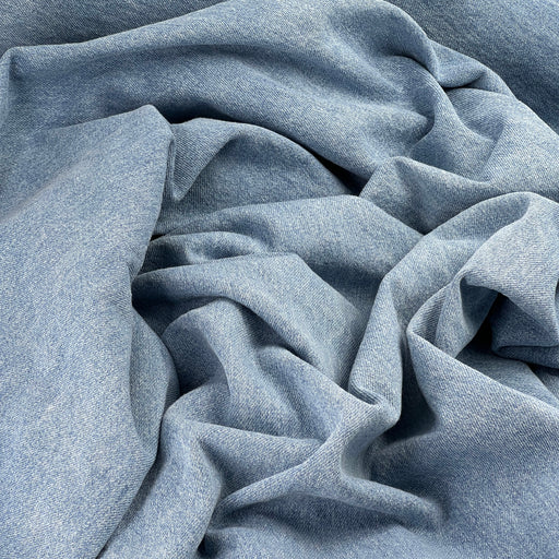 Bundle of denim featuring a blue wash coloring. 