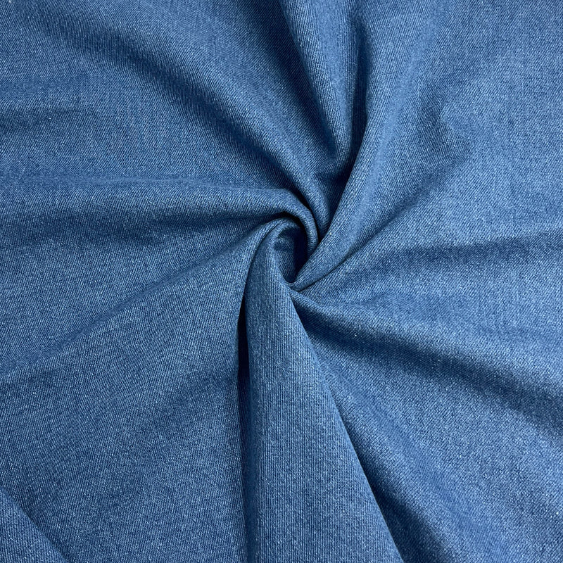 Blue washed denim folded into a swirl showing off soft texture