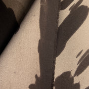 Closeup of the left selvedge of brown bull denim with a dying imperfection resulting in a unique cow spotting effect. 