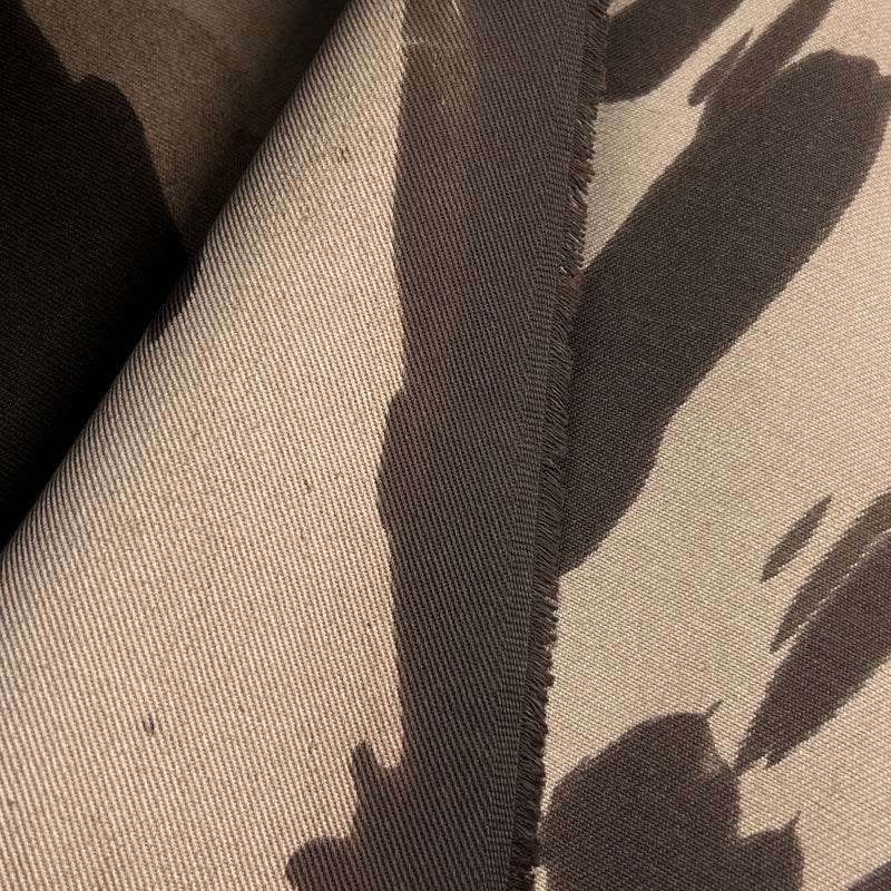 Closeup of the left selvedge of brown bull denim with a dying imperfection resulting in a unique cow spotting effect. 