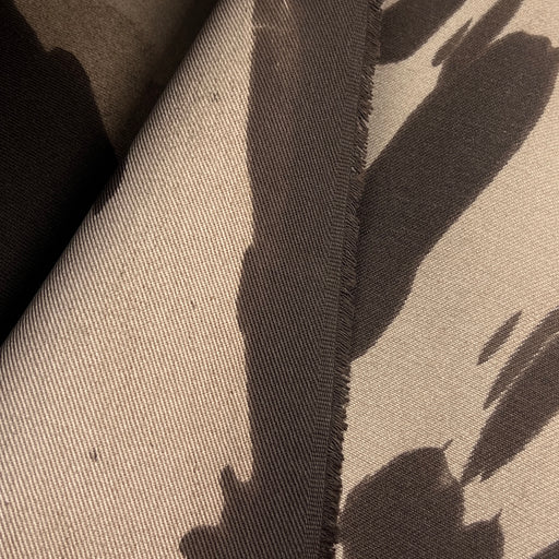 Closeup of the left selvedge of brown bull denim with a dying imperfection resulting in a unique cow spotting effect. 