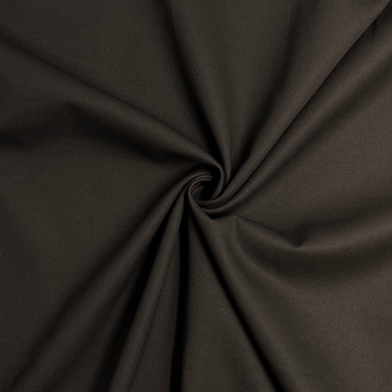 Close-up of dark brown fabric with a visible crease