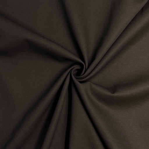 Close-up of dark brown fabric with a visible crease