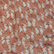 Rose gold lace fabric with sequins and metallic embroidery on a white mesh background.