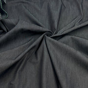 Dark charcoal gray fabric draped in a spiral pattern to show its texture and drape.