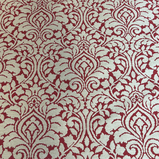 Red and beige damask patterned fabric shown in a close-up texture view.