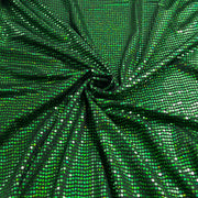 Green sequined fabric with a spiral swirl pattern, showing a dense texture of small reflective green and silver sequins.