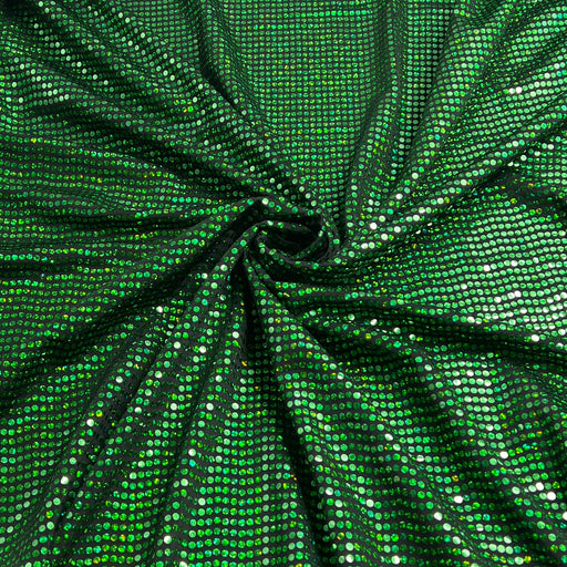 Green sequined fabric with a spiral swirl pattern, showing a dense texture of small reflective green and silver sequins.