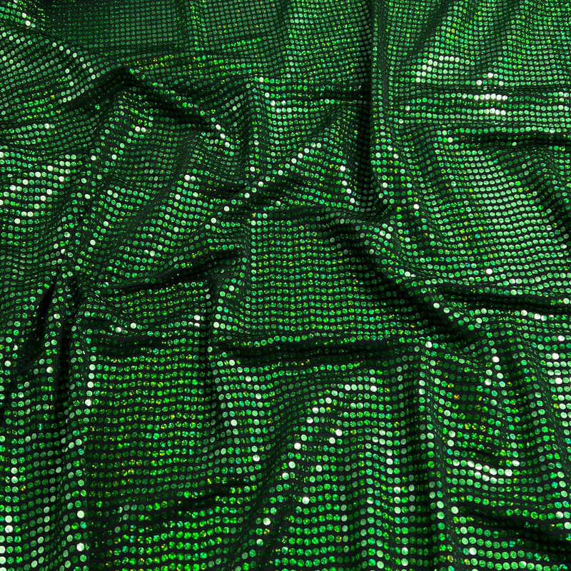 Green sequined fabric with a shimmering, metallic finish, draped in soft folds to show its texture and reflective properties.