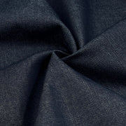 A close-up of dark navy blue textured fabric gathered in the center to show its weave and drape.