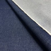 Closeup of indigo heavyweight denim showing twill texture and both face and reverse