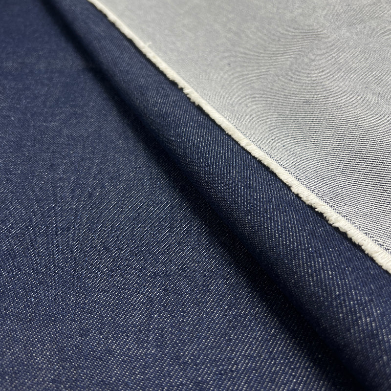 Closeup of indigo heavyweight denim showing twill texture and both face and reverse