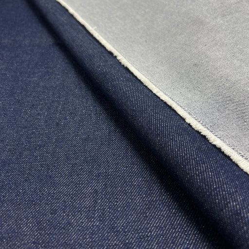 Closeup of indigo heavyweight denim showing twill texture and both face and reverse