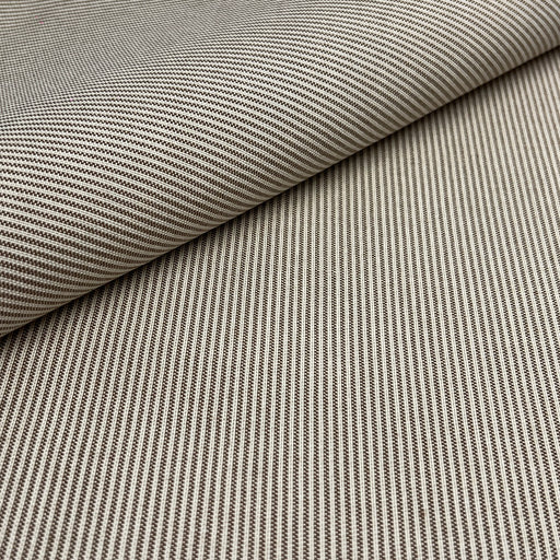 A close-up of woven fabric with a fine striped pattern in beige and brown, shown with one corner folded over to reveal the texture.