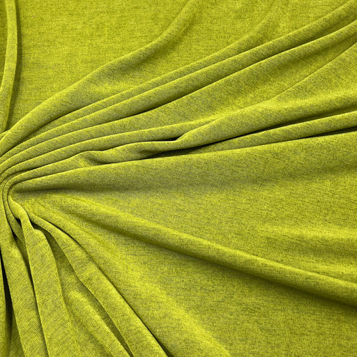 A close-up of draped olive green fabric with a textured, heathered finish, arranged in soft folds radiating from the center.