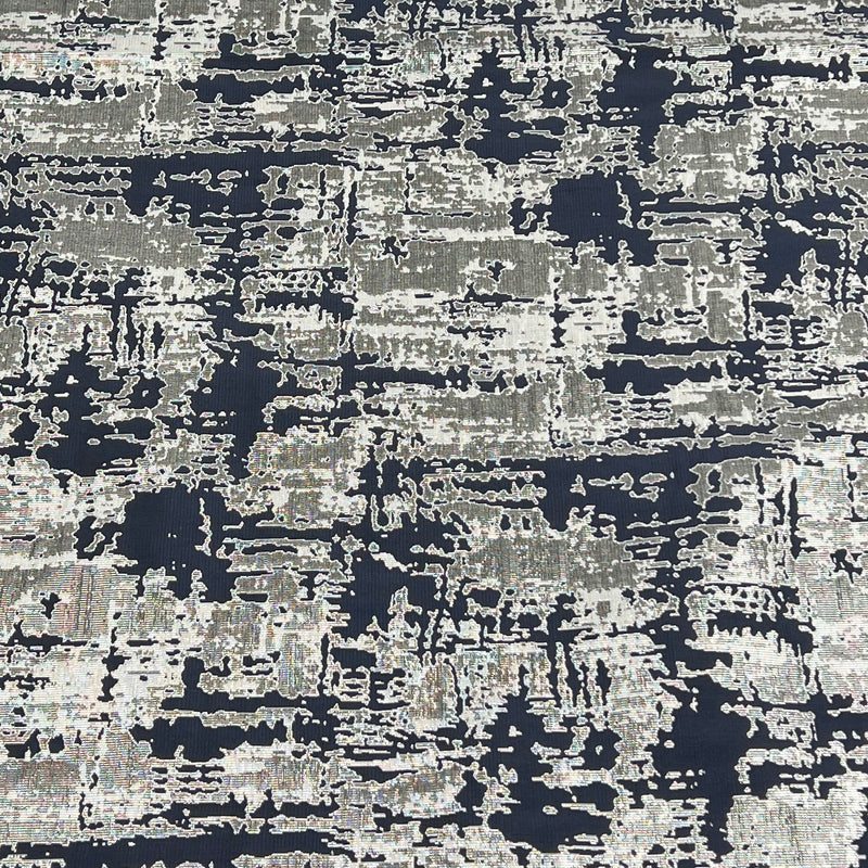An abstract distressed pattern featuring a textured blend of navy blue, charcoal gray, and off-white in a horizontal, layered design.