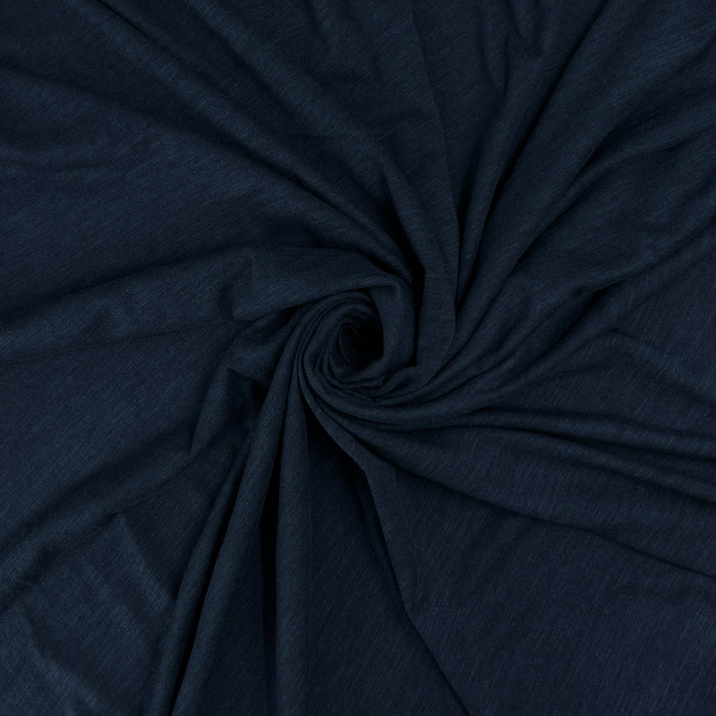 Dark navy blue fabric draped in a spiral pattern to show its texture and drape.