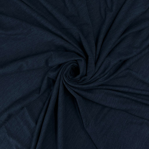 Dark navy blue fabric draped in a spiral pattern to show its texture and drape.