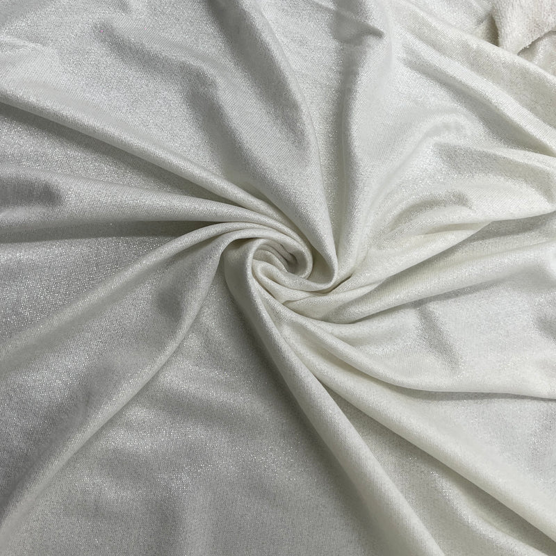 A close-up of draped metallic French terry with a subtle sheen, shown arranged in a spiral fold pattern.