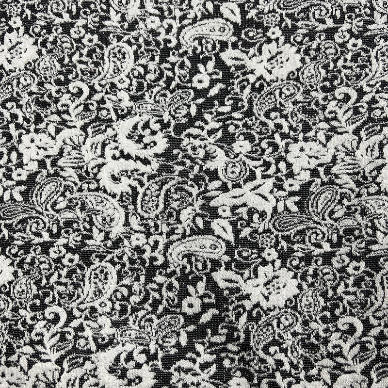 Black and white damask fabric with an intricate floral and paisley pattern.