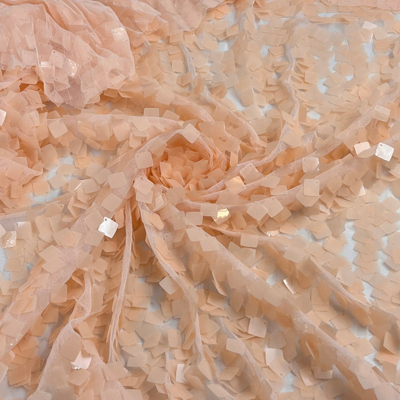 Sheer stretchy mesh fabric with 1/2 inch square shaped Payette sequin forming a full coating over the otherwise sheer surface.