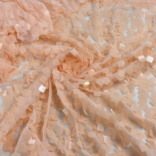Sheer stretchy mesh fabric with 1/2 inch square shaped Payette sequin forming a full coating over the otherwise sheer surface.