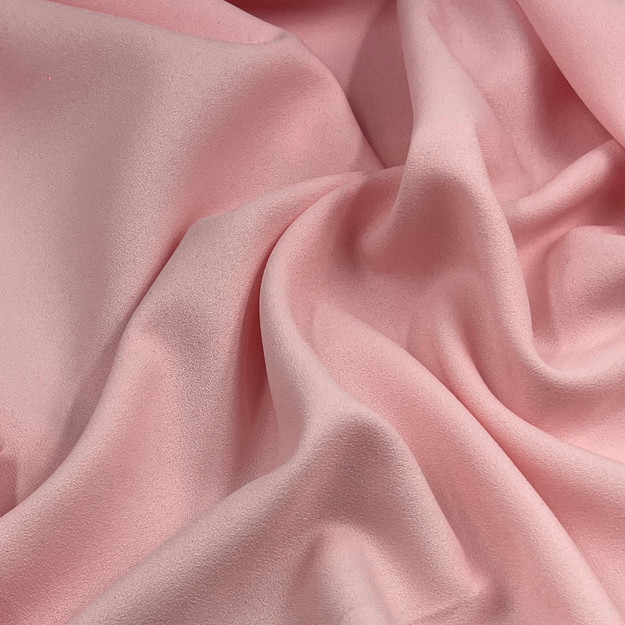 Pink textured polyester crepe fabric for suits