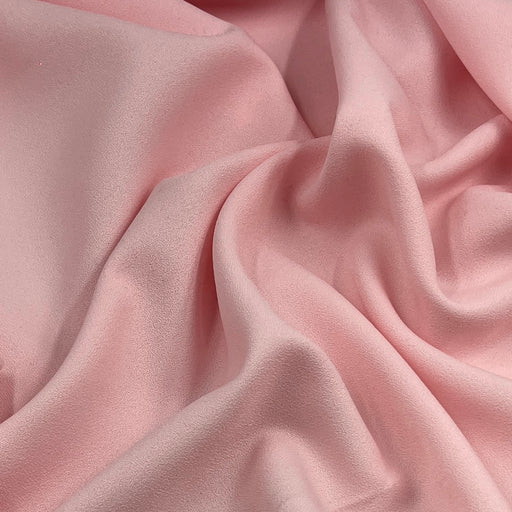 Pink textured polyester crepe fabric for suits