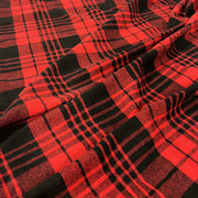 Red and black buffalo plaid fabric with a soft draped texture.