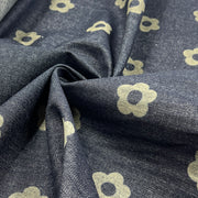 Custom laser printed fabric featuring a retro floral design on a 30" wide indigo denim fabric