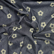 Custom laser printed fabric featuring a retro floral design on a 30" wide indigo denim fabric