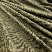 A close-up of olive green unbrushed fleece fabric, pulled to the side to demonstrate drape.