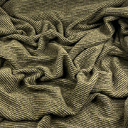 A close-up of a textured, olive green and beige striped knit fabric with a ribbed pattern, shown in soft folds.
