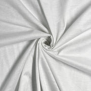 Closeup of white jersey knitted fabric with gold lurex threads knitted into the structure giving it a lustrous sheen